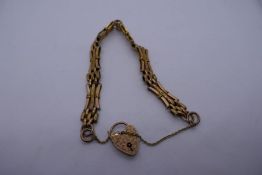 9ct yellow gold 3 bar gate link bracelet with heart shaped padlock clasp, marked 9ct, approx 12g