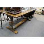 A reproduction oak refectory table on melon bulb supports, 183cms