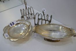 Two silver toast racks, a Mappin and Webb silver bon bon dish, and a Britannia silver 1953 with the