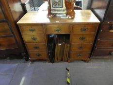 Vintage oak kneehole desk with 9 drawers and brass handles on bracket supports