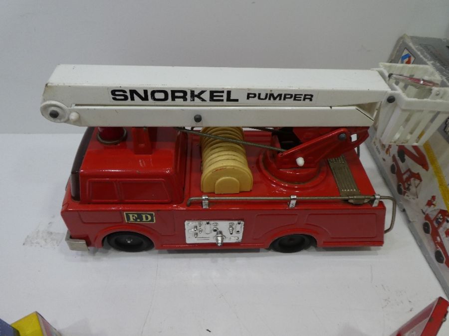 A quantity of vintage tin plate fire engines, Coca Cola trucks and train - Image 2 of 6