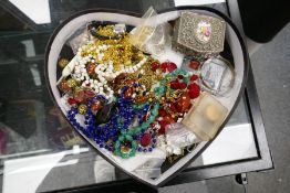 A mixed collection of costume jewellery to include bead necklaces, wristwatch, silver bangle, etc