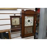 Two wall hanging wooden cased clocks, one eight day and 30 hour brass clock with floral glass decora