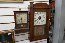 Two wall hanging wooden cased clocks, one eight day and 30 hour brass clock with floral glass decora