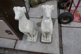 A pair of greyhound stone effect dogs