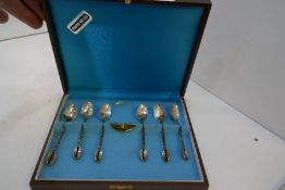 A cased set of six silver coffee spoons of ornate design, with decorative foliate design, with decor