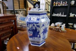 A Chinese hexagonal blue and white jar and cover decorated figures and flowers, height 32cms