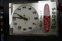 A vintage advertising clock for Wardonia blades and two Ronson cigarette lighters