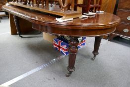 A Victorian mahogany extending dining table, having 2 leaf (1 made of stained pine) extended length