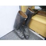 A Pair of vintage black horse riding boots with markings inside saying 9 5G 1793