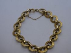 Pretty 9ct yellow gold bracelet with circular links, and safety chain, marked 375, 25g approx