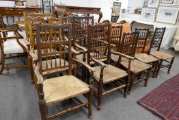 A quantity of spindle back country chairs, having rush seats to include 6 x carvers and 5 x singles