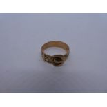 9ct yellow gold buckle ring with engraved decoration, marked 375, size W, 3.8g approx