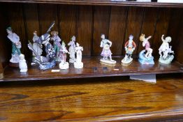 Two Royal Worcester figures 'April' and 'July', two German figures and others (a shelf)