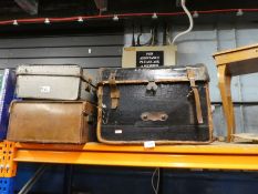 Selection of vintage luggage and vintage sewing box