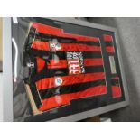 A signed, framed Bournemouth football shirt 2016/2017