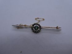 Pretty white and yellow metal bar brooch with safety chain, with green sapphire surrounded grey and