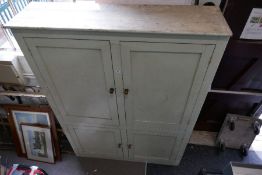 An old pine housekeeper's cupboard, early 20th century having 2 pairs of cupboard doors, 152cmwide a