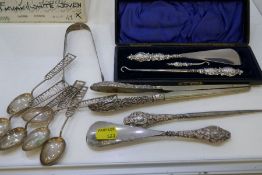 A cased set of silver handled ware of ornate and decorative design with Angels. Also with two other
