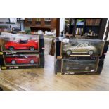 Four x Maisto and Revell 1/18 scale die-cast cars to include Porsche Boxster, VW Beetle, Mercedes SL