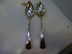 A silver Georgian serving spoon hallmarked London 1799 George Smith and another Georgian spoon hallm