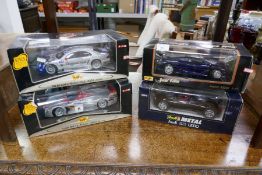 Four Maisto and Revell 1/18 scale die-cast cars to include Mercedes, Audi and Jaguar examples