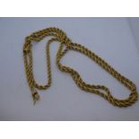 Yellow metal rope twist long necklace, 123cm, 125.9g, tested 9ct or higher