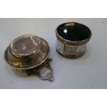 A silver tea strainer with two decorative handles hallmarked Thomas Bradbury and Sons Ltd 1915 - 16