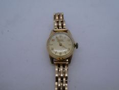 Vintage 14K yellow gold Doxa wristwatch on 14K yellow gold strap, marks worn, 38.8g approx weight wi
