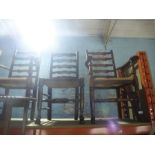 Two oak bar back rush seat armchairs and 2 chairs