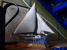 A large heavy cast iron doorstop in the form of a sailing boat, including a copy of the Sailor's pra