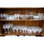 A quantity of glass ware, mainly by Stuart, 2 shelves