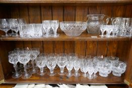 A quantity of glass ware, mainly by Stuart, 2 shelves