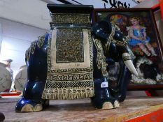 Large ceramic plant stand in the form of an Elephant including tapestry fire guard