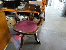 Vintage mahogany revolving captain's chair with studded fabric seat