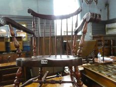 Vintage mahogany spindle back rocking armchair