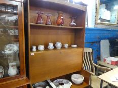 Mid Century teak wall unit with shelves, writing compartment above cupboards by Nathan