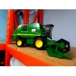 A large scale John Deere Combine Harvester, working model, made in Germany by Bruder