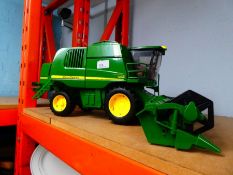 A large scale John Deere Combine Harvester, working model, made in Germany by Bruder