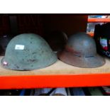 Selection of various metal military helmets British and European etc