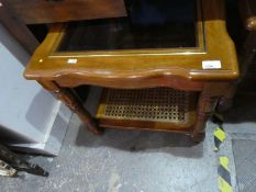 Pair of glass top mahogany coffee tables with cane under tiers