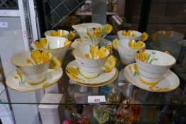 An art Deco tea set by Paragon, having flower handles