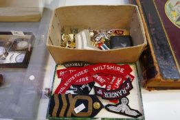 A small quantity of military shoulder badges, buttons, badges and similar