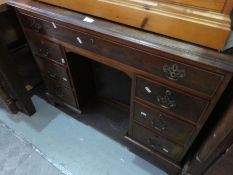 Mahogany desk with one long and 6 short drawers and central cupboard