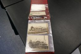 An album of Victorian and later postcards containing Steam trains and topographical examples