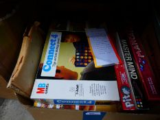 A box of various vintage games including Guess Who and Connect