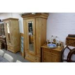 A Victorian pine wardrobe having one drawer and a pine wash stand with raised back