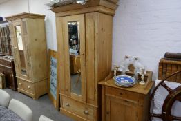 A Victorian pine wardrobe having one drawer and a pine wash stand with raised back