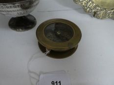 Compass with magnifying glass