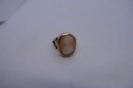9ct yellow gold signet ring set with an oval cameo (worn) on split shoulder, 7.4g approx, marked 9ct